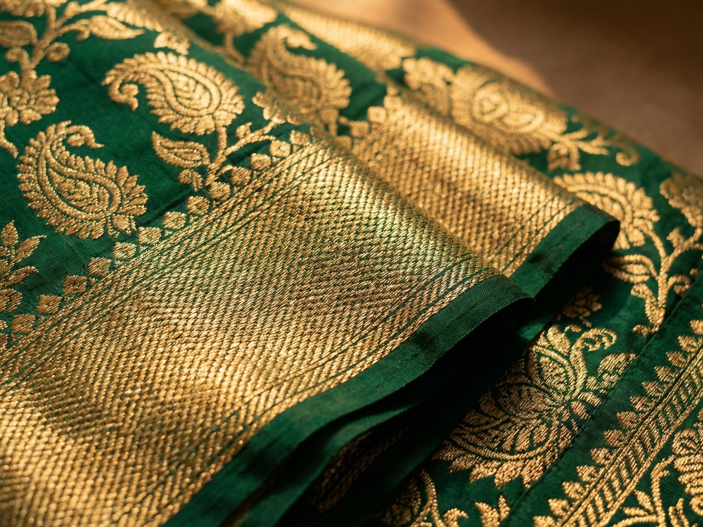 Close-up of brocade fabric used in premium Laddu Gopal poshak at Gopalji Fashion